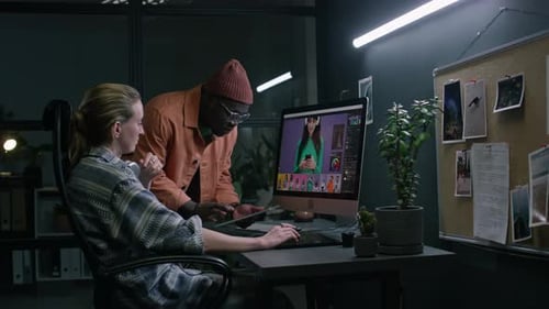 Diverse Colleagues Working on Advertising Photos in Postproduction Studio