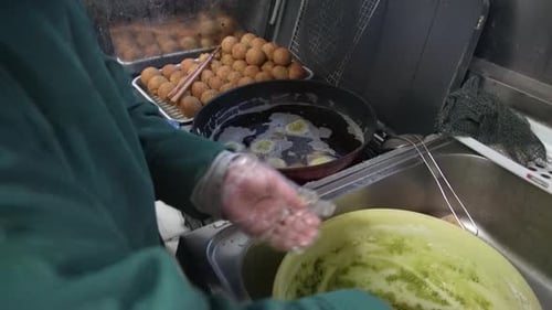 Chef Making Falafel Balls in Restaurant Kitchen