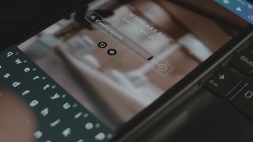 Creative Spaces Inscription on Smartphone Designer Making an Advertisement Design on Mobile App