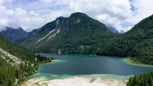 View to Julian Alps mountains above Predil lake in Italy with small lake. Predil Lake, Friuli Italy