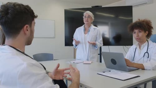 Medical Team Meeting in Office Setting