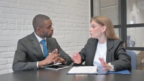 Professionals Meeting in Office Discussing Documents