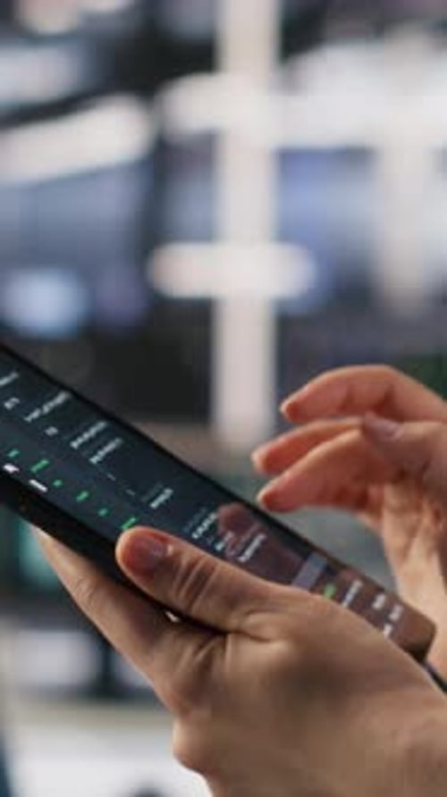 Vertical Video Close Up of Data Center System Administrator Coding on Tablet