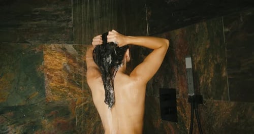 Woman Washing Hair in Shower