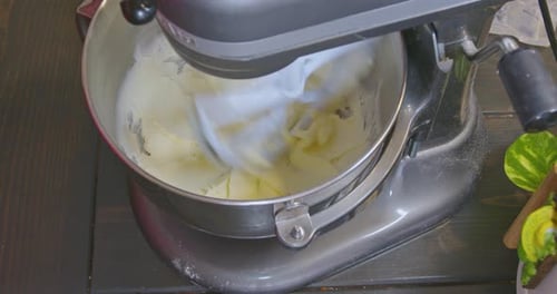 Adding sugar to butter that’s been creamed while the mixer is still mixing.