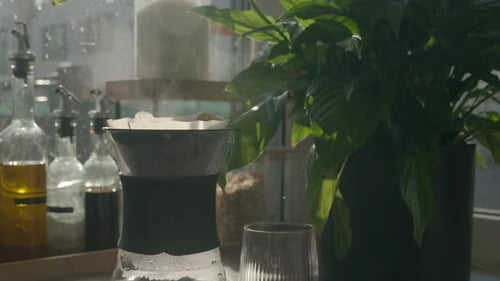 Pour Over Coffee Steaming on Sunny Kitchen Counter