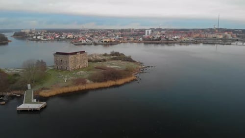 Aerial footage of Kruthuset a historical old building located in the ocean at Karlskrona, Sweden. I