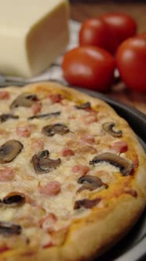 Delicious pizza with mushrooms, cheese, and tomatoes