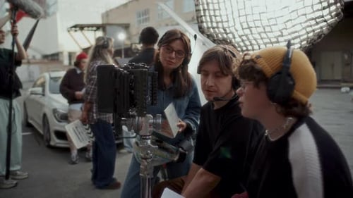 Video Production Crew Discussing Captured Scene on Camera Monitor on Set