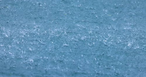 Abstract background, rain drops on the water.