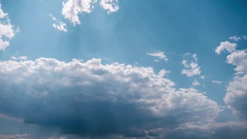 Soft White Cumulus Clouds Slowly Move in the Blue Sky Timelapse