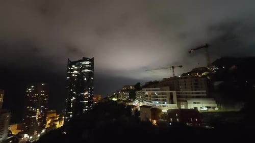 View of the Illuminated Skyscrapers of Monte Carlo at Night Timelapse