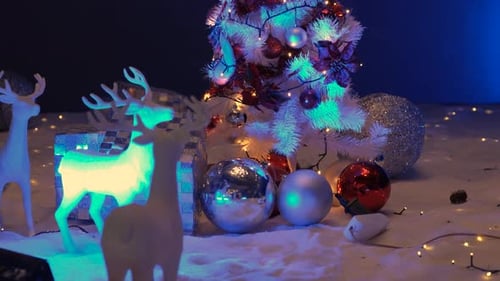 Festive Christmas Tree Scene with Glowing Reindeer