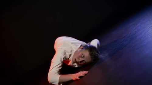 Suffering Woman Dancing in Mysterious Darkness Portrait in Motion in Studio Crazy Face of Beautiful