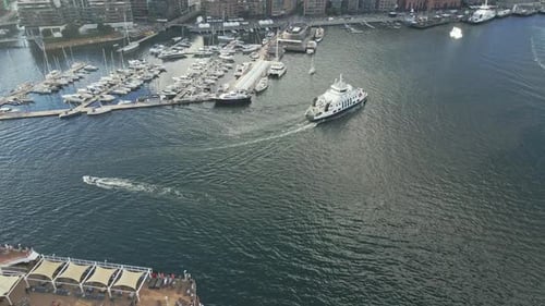Flying over a cruise ship toward a marina in Oslo Norway