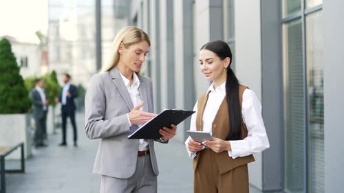 Happy two woman employees shaking hands for support. Handshake, co-workers women business