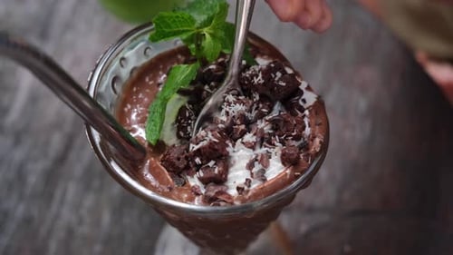 Delicious Chocolate Pudding Dessert with Mint and Cream