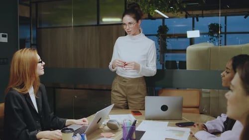 The Upcoming Team Meeting Will Showcase a Professional Female Leader Presenting Innovative Ideas to