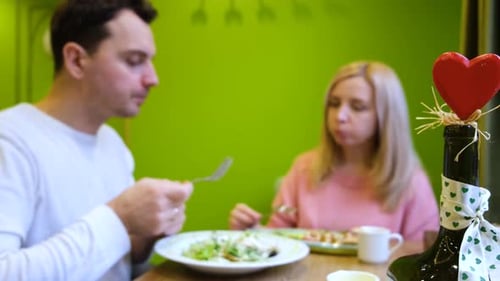 Couple Eating Together at Restaurant Table