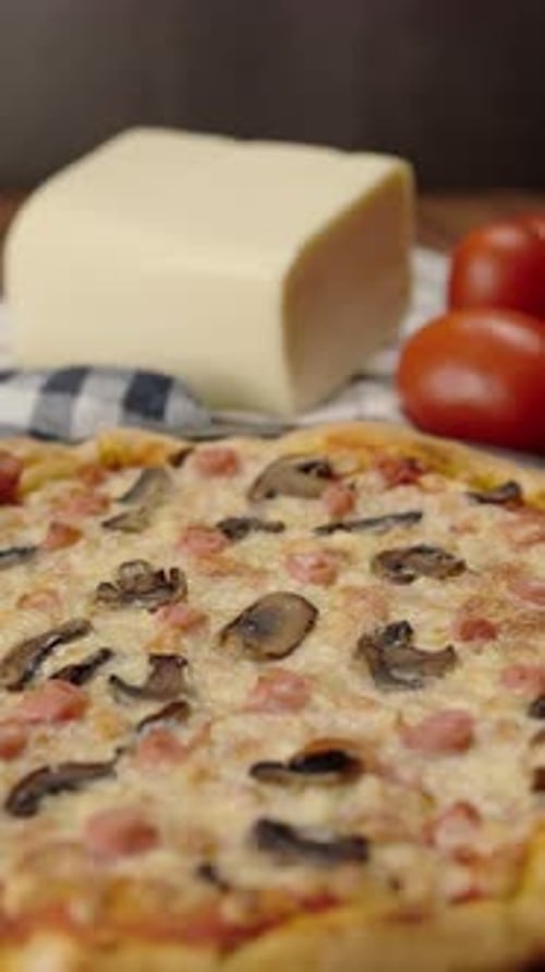 Mushroom pizza with mozzarella cheese and tomato background