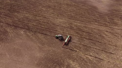 Machinery tractor plowing in orbit at Buenos Aires Argentina aerial