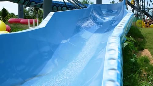 Little Girl Jumps Into an Inflatable Circle with a Pool Side Children Have Fun and Play Dives on the