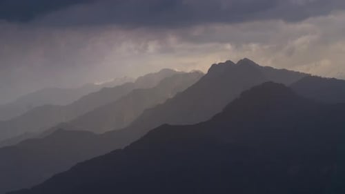 Moody Mountains and Soft Sunlight Scenic Landscape