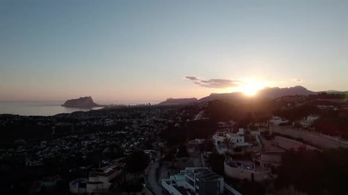 Dramatic View Of Calpe Town At Sunset On The Costa Blanca In Alicante, Spain. Aerial Shot