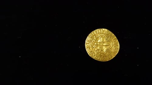 Goldmünze auf schwarzem Hintergrund 05