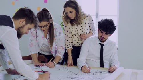 Group of Young People Working Together in an Office