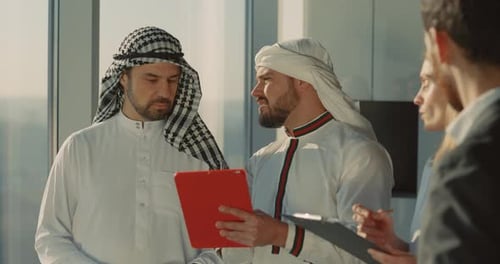 Mulsim Wealthy Couple of Entrepreneur Investors Talkingto Office Managers Colleagues Inside Company