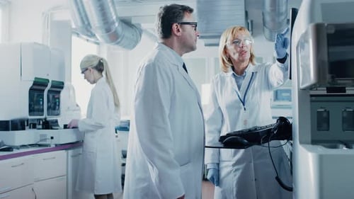 Scientists Analyzing Data in Modern Lab Setting