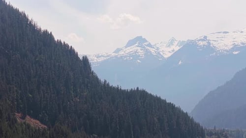 Breathtaking Mountain Landscape with Lush Evergreen Forests and Peaks in British Columbia, Canada.
