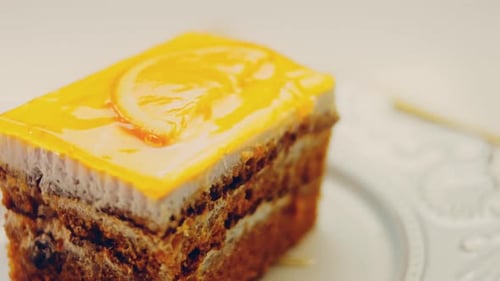Waviness Effect of A Piece of Tangerine Cake with Jelly