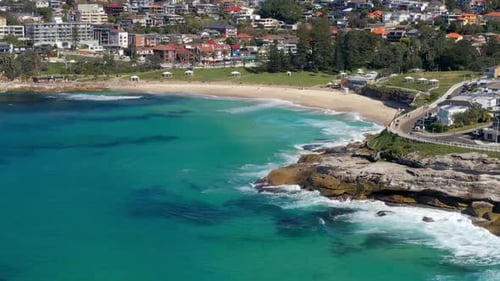 Bronte Beach With Waves Crashing Against Rocky Cliffs Of Bronte Marine Drive At NSW, Australia. - ae