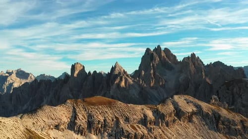 Giant Mountains Range with Rocky Peak Under Blue Sky
