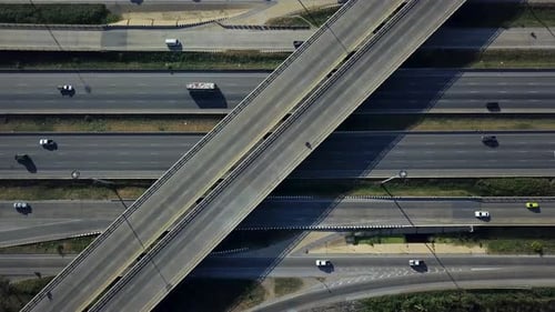Busy complicated city highway interchange exit with car traffic aerial drone shot zoom in