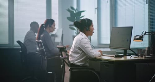 Diverse Team of Technical Support Operators in Modern Call Center Office