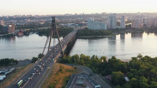 Evening Urban Scape with a Bridge Above the River
