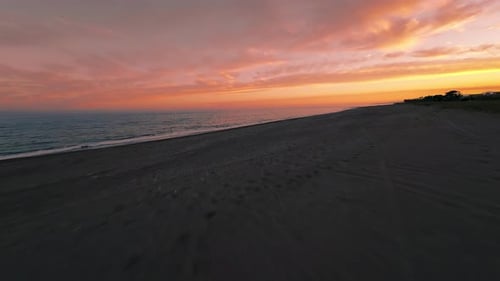 Sunset Sky and Clouds Over the Sea Waves