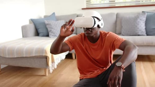Young Adult Using Virtual Reality Headset Indoors