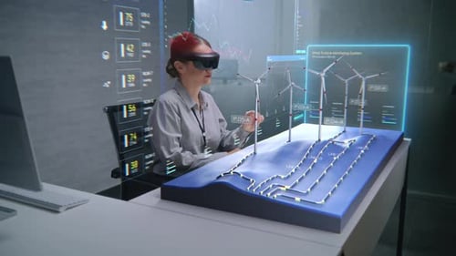 Fortgeschrittene Büroangestellte verwendet Augmented-Reality-3D-Hologramm zur Visualisierung eines Windparks