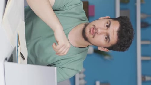 Excited Man Celebrating Success at Home Office