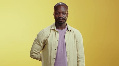 Man Offering Red Gift Box With Gold Ribbon