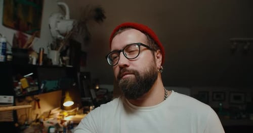 Closeup Male Artist Paints a Canvas in His Art Studio