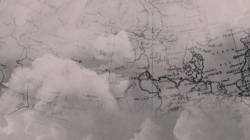 A slow-motion collage of a map of the world that gradually Appears on old crumpled paper.