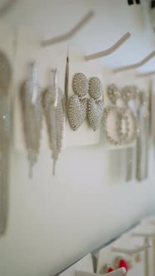 Elegant Sparkly Earrings on Display Wall