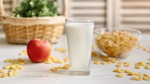 Refreshing Breakfast with Milk, Cereal, and Apple