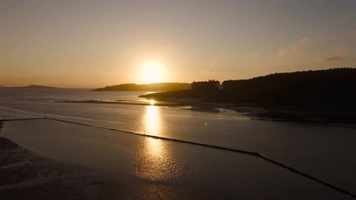 Aerial View Of Calm Ocean At Sunset From Ria Do Porto In Spain.
