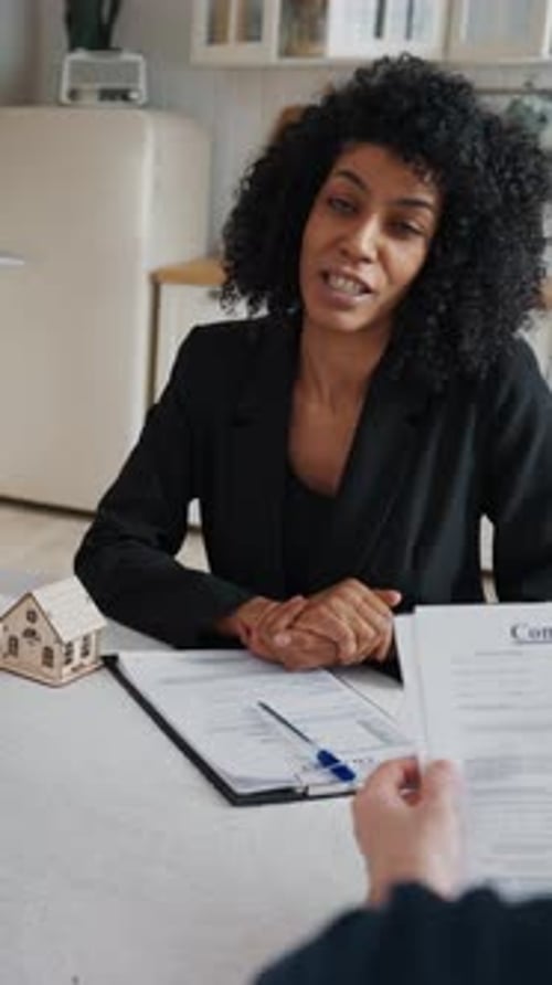Discussion About Real Estate Deal Mature Spouses Consultation with Female Agent Charming African